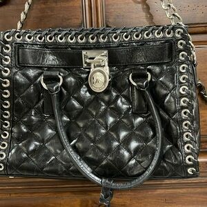 Michael Kors, black tufted purse with handles and shoulder strap w/silver accent